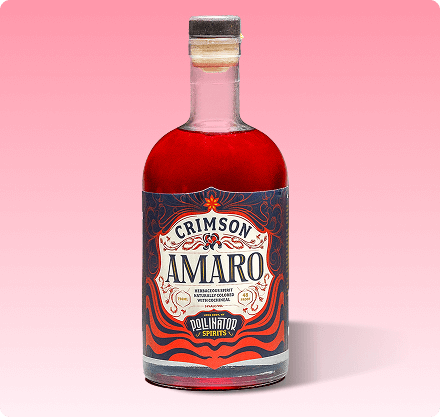 A bottle of Crimson Amaro with a red liquid visible and a label that includes the brand name and the word 'AMARO' on a pink background.