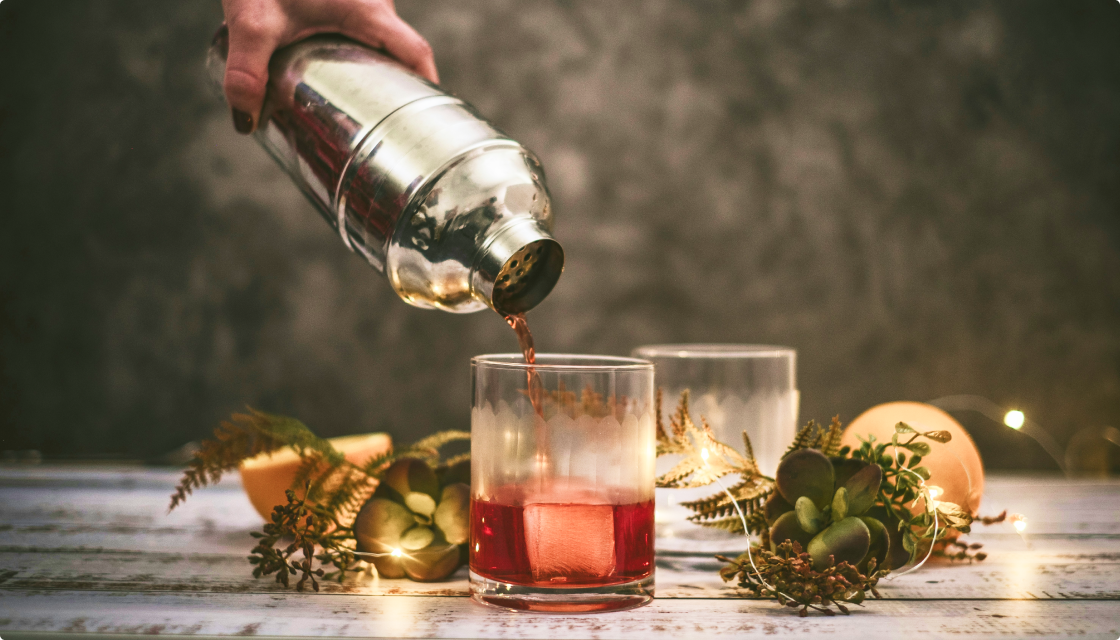 Guests enjoying artisanal Thanksgiving cocktails with gin, vodka, rye, and amaro from Pollinator Spirits