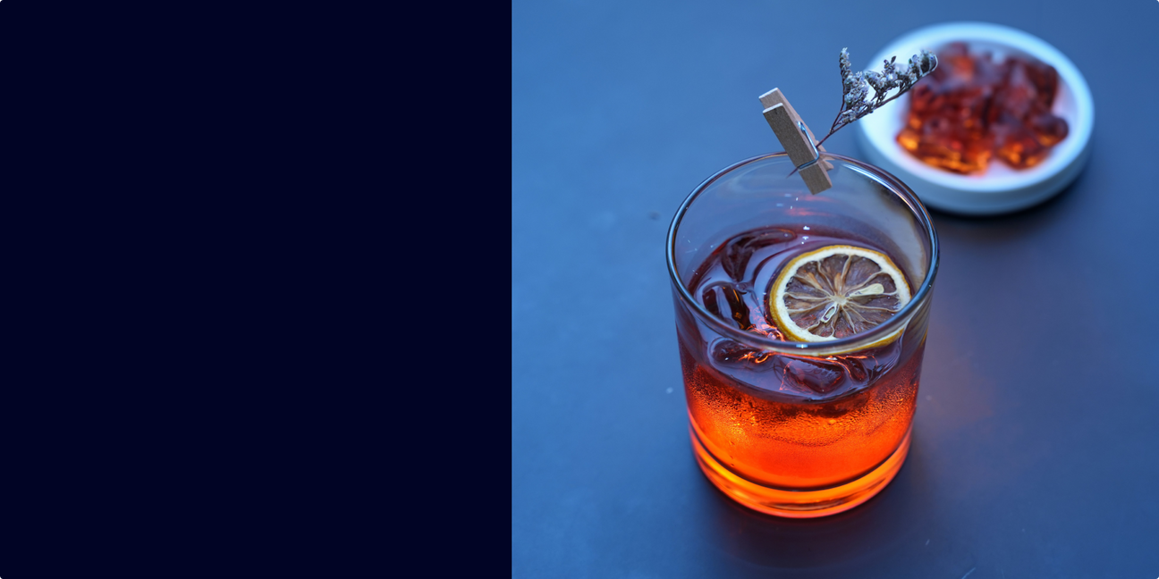 Glass of Bonfire Cider cocktail made with Bonfire Rye whiskey, apple cider, and cinnamon garnish