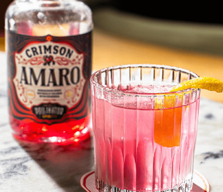 Vibrant crimson aperitivo spirit paired with a refreshing herbal cocktail