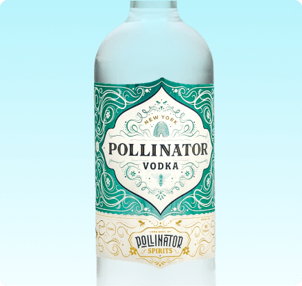 A bottle of Pollinator Vodka with a label featuring intricate green and white designs and the name 'Pollinator Spirits' at the bottom.